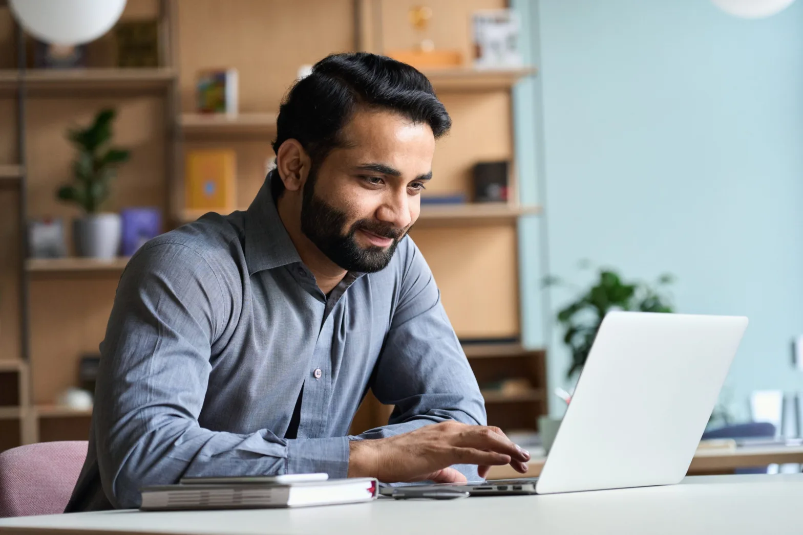 Man typing on laptop