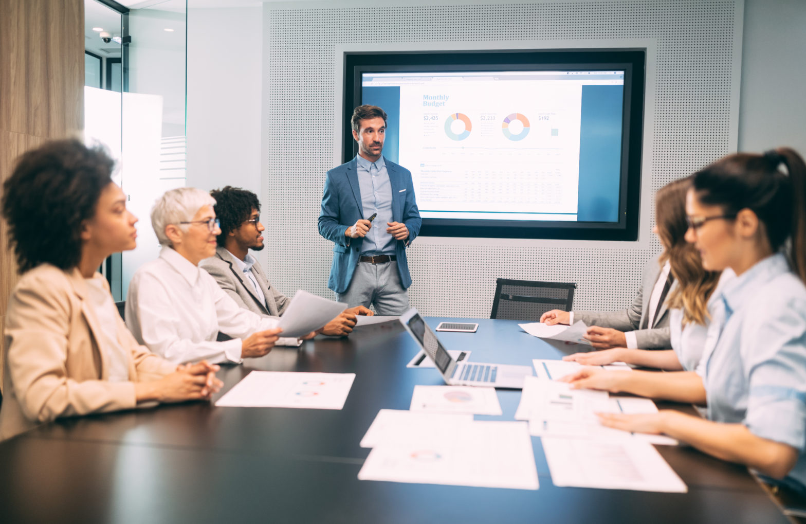 Group of employees discussing ERP in a boardroom