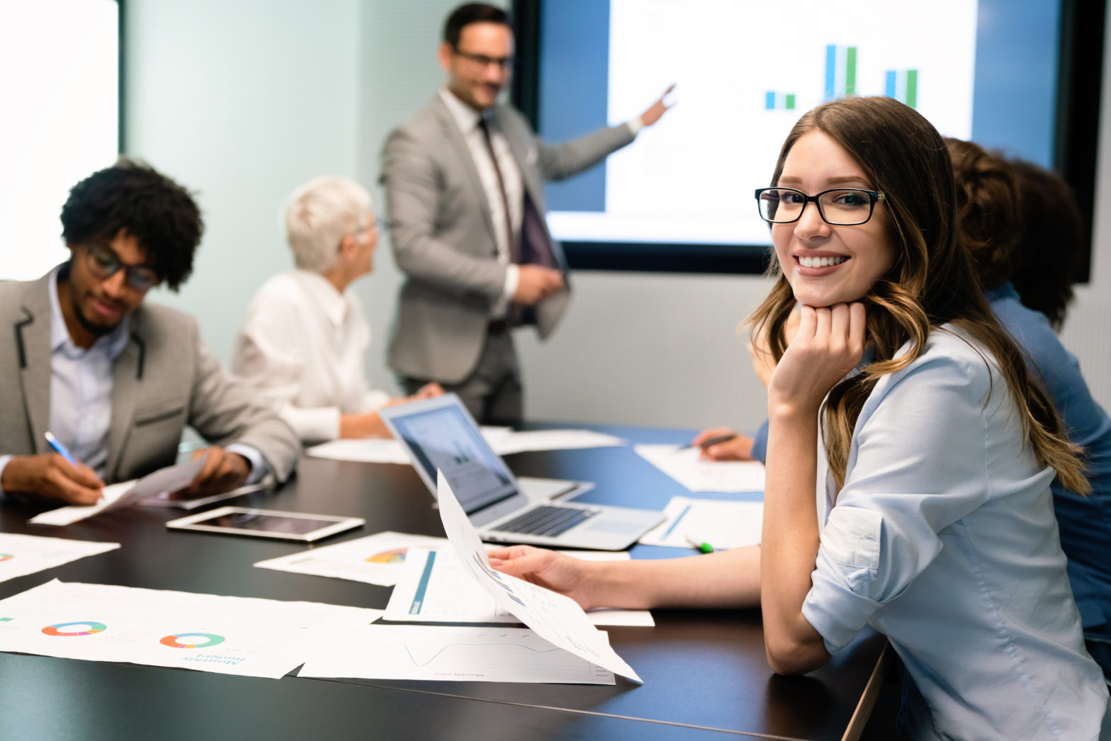 Employees in boardroom