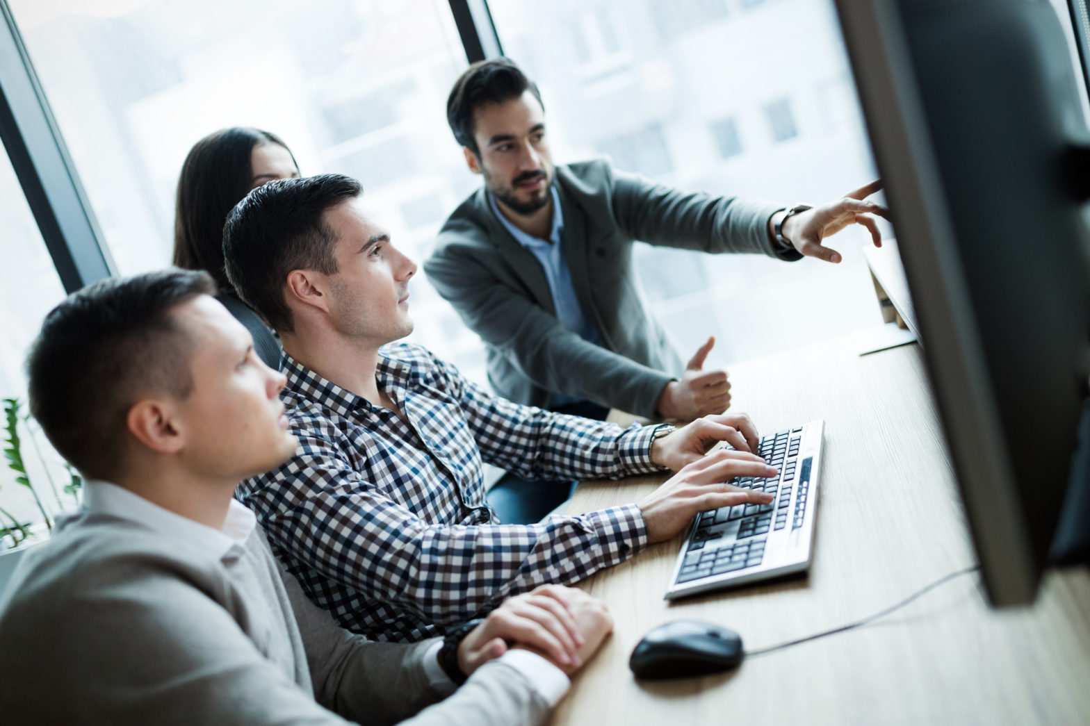 employees working together on computer