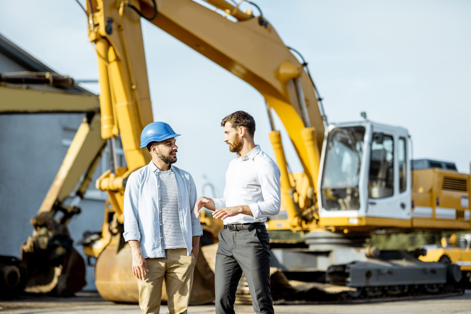 Business man consulting at a equipment rental business