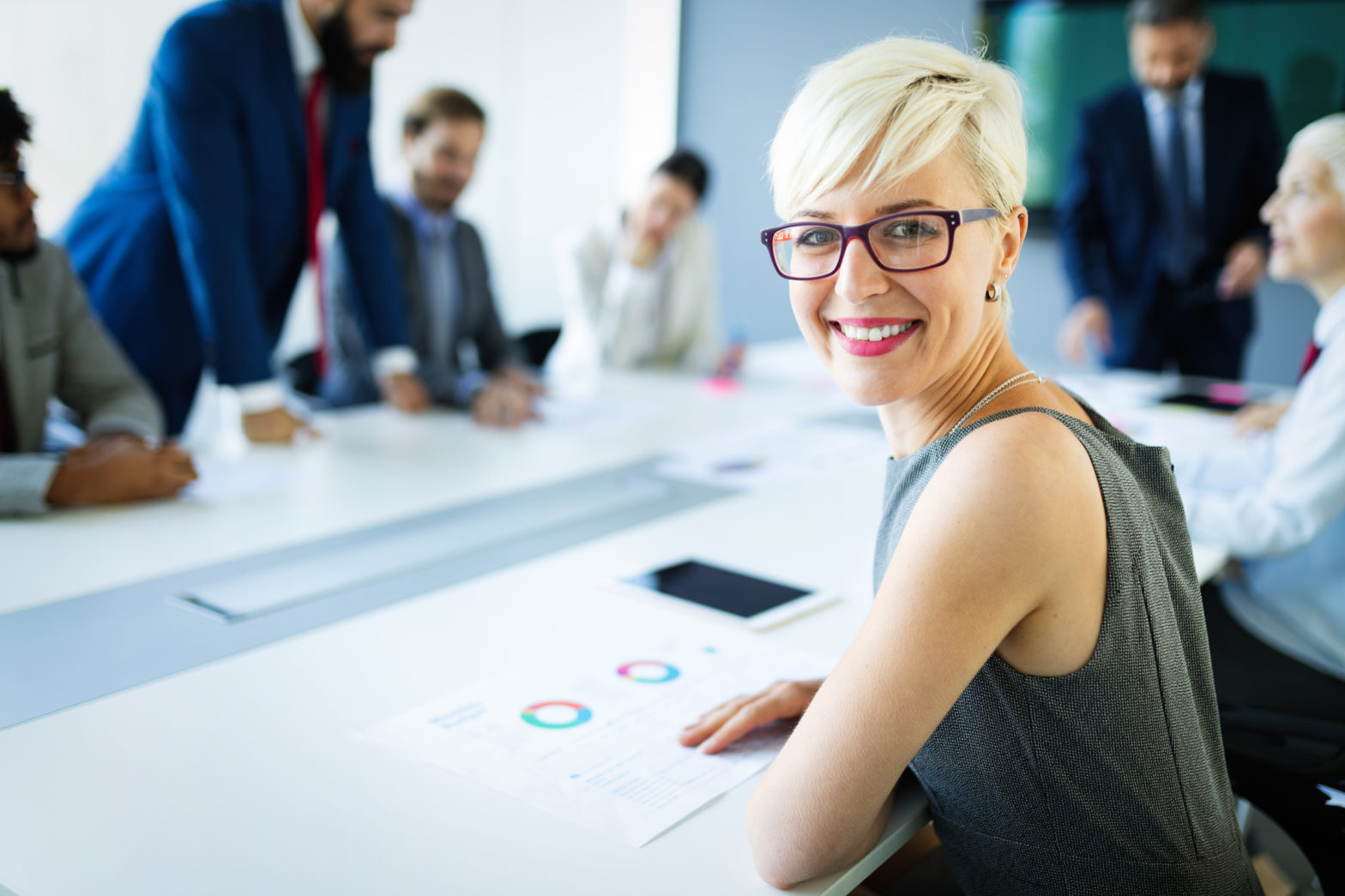 Woman smiling in boardroom