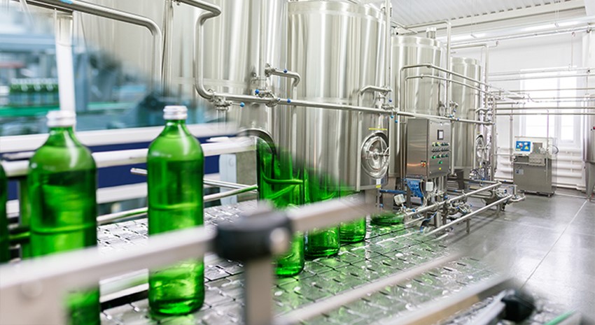 Glass bottles on conveyor belt