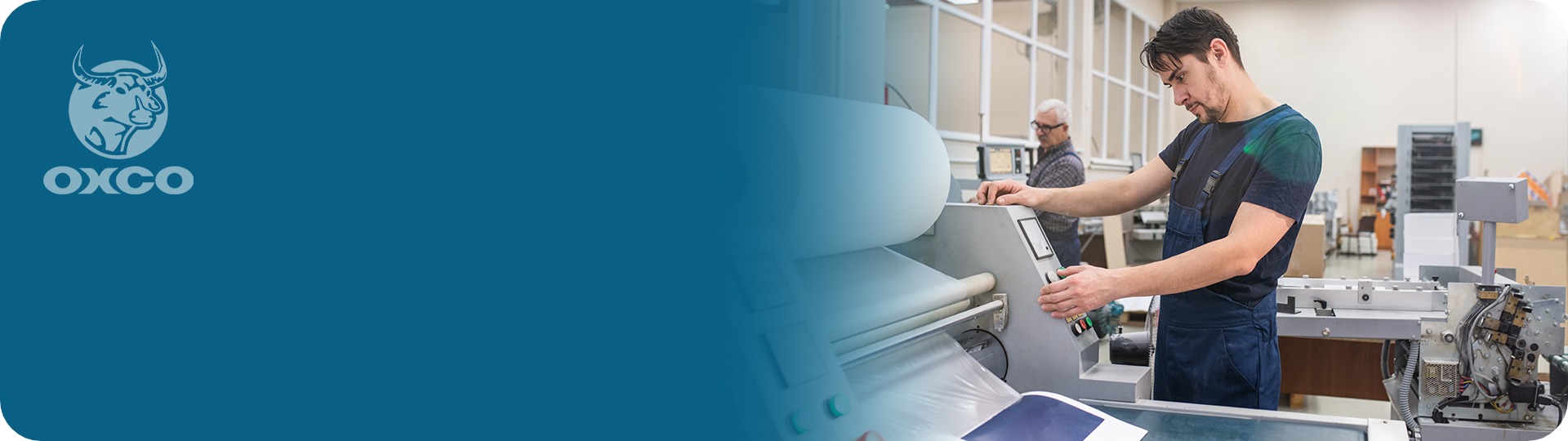 Man working on printing machine with OXCO logo