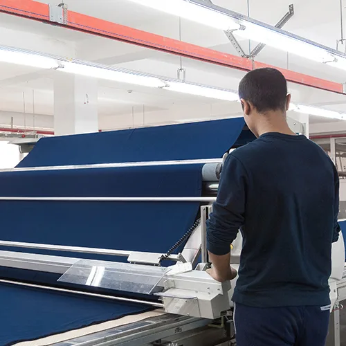 Man working on fabric machine